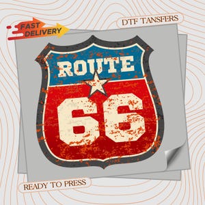 May include: A distressed Route 66 graphic on a gray background. The design features a shield shape with blue, red, and white colors, and the text "ROUTE 66". Additional text includes "FAST DELIVERY", "DTF TRANSFERS", and "READY TO PRESS".