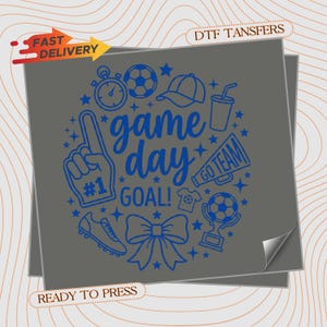May include: A gray DTF transfer sheet featuring blue line art graphics including a foam finger, soccer ball, stopwatch, baseball cap, drink cup, megaphone with text GO TEAM, t-shirt, soccer cleat, bow, and trophy, with the text game day GOAL!