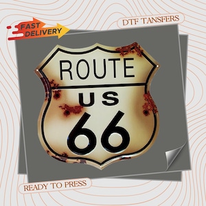 May include: A Route 66 sign with a distressed, vintage look. The sign features the words "ROUTE US 66" in black lettering. The sign has a weathered appearance with rust-colored spots. The image also includes text that says "FAST DELIVERY" and "READY TO PRESS".