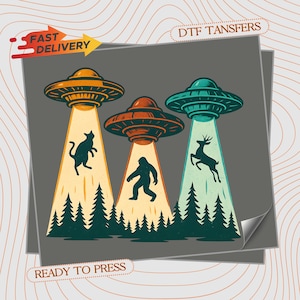 May include: A DTF transfer sheet featuring a graphic of three UFOs hovering over a dark forest. The UFOs beam light down, lifting a cat, a Bigfoot, and a deer. The text reads FAST DELIVERY, DTF TANSFERS, and READY TO PRESS in a retro style.