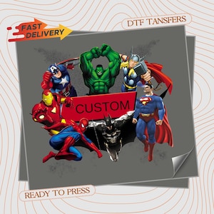 May include: A DTF transfer sheet featuring a group of comic book superheroes including Captain America, Hulk, Thor, Iron Man, Spider-Man, Batman, and Superman. A red rectangular banner in the center displays the word CUSTOM. Text reads FAST DELIVERY.