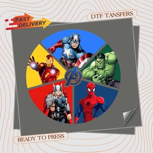 May include: A circular graphic design featuring five Marvel superheroes: Captain America, Iron Man, Hulk, Thor, and Spider-Man, arranged in segments around a central Avengers logo. The text reads FAST DELIVERY, DTF TANSFERS, and READY TO PRESS.