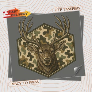 May include: A DTF transfer sheet featuring a detailed illustration of a deer head with large antlers centered within a hexagonal frame. The background inside the hexagon has a green, brown, and tan camouflage pattern. Text reads FAST DELIVERY.