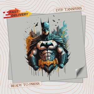 May include: A DTF transfer featuring a graphic illustration of Batman in a blue and black suit with a yellow utility belt. The design includes a stylized city skyline, flying bats, and paint splatter effects. Text reads FAST DELIVERY and READY TO PRESS.