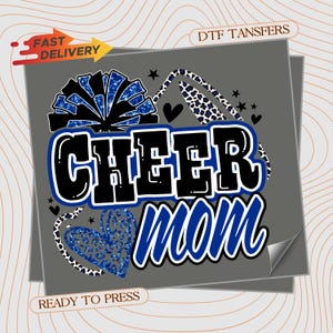 May include: A DTF transfer sheet featuring the text CHEER mom in bold black and blue lettering. The design includes a blue glittery pom-pom, a leopard print megaphone, and a blue leopard print heart, accented with small black stars and hearts.
