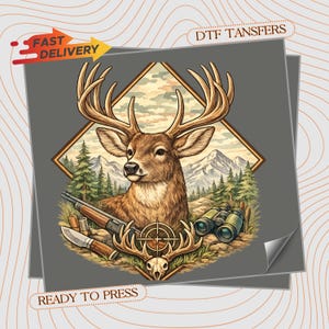 May include: A DTF transfer sheet featuring a graphic of a deer head with large antlers, a rifle, binoculars, a knife, and a skull. The design is set against a mountain and forest background within a diamond frame. Text includes FAST DELIVERY and READY TO PRESS.