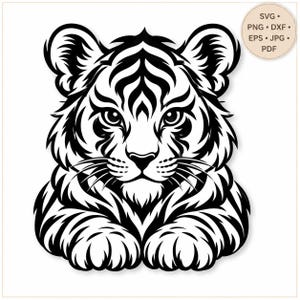 May include: A black and white graphic illustration of a tiger cub face with bold stripes and whiskers. A circular badge in the top right corner contains the text SVG, PNG, DXF, EPS, JPG, and PDF, indicating available digital file formats.