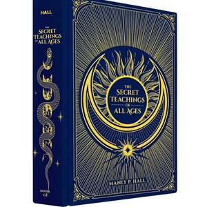 May include: A hardcover book titled "The Secret Teachings of All Ages" by Manly P. Hall. The book has a dark blue cover with gold-colored illustrations, including a sunburst design and a serpent. The spine features a serpent illustration and the word "HALL".