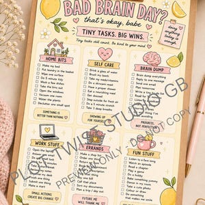May include: A clipboard holding a Bad Brain Day checklist with pastel illustrations of lemons, hearts, and a brain. The document features sections for home bits, self-care, brain dump, work stuff, errands, and fun stuff with checkboxes for tasks.