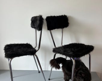1970s chairs with black fur upholstery.