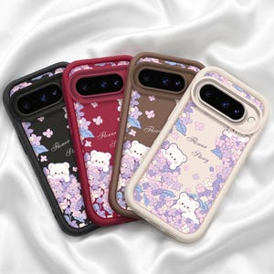 May include: Four smartphone cases in black, dark red, brown, and cream. Each case features a camera cutout, a graphic of a white bear peeking through purple and blue hydrangea flowers, and the cursive text Flower Story printed on the back.