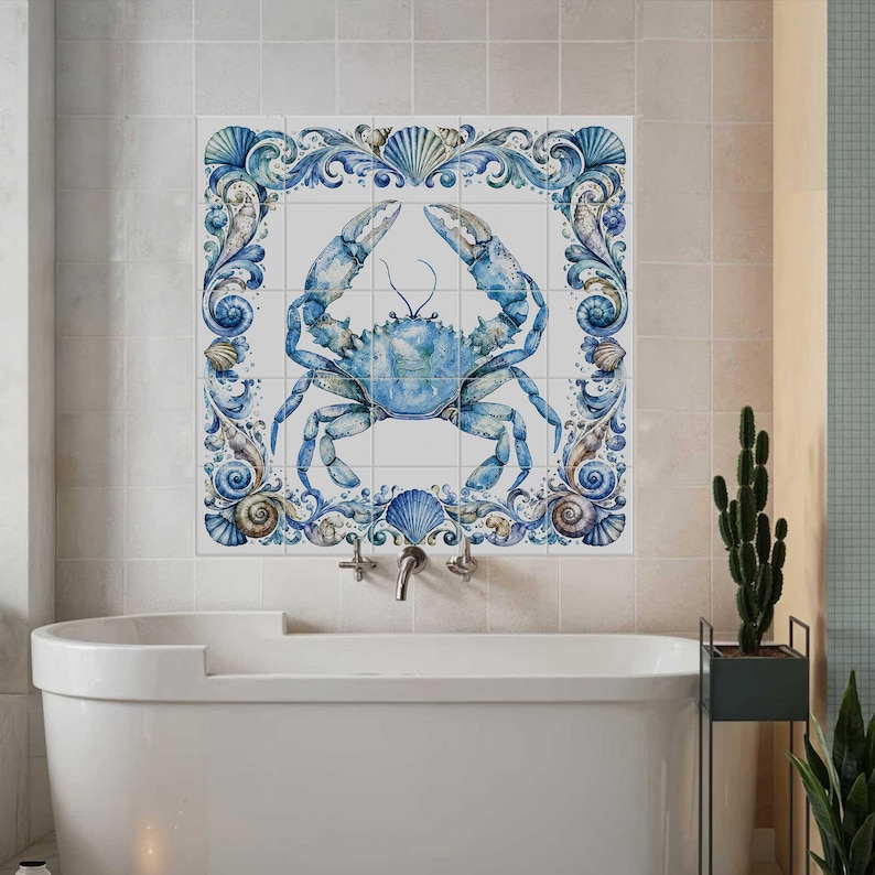 Ceramic tile mural featuring a watercolor blue crab surrounded by ornate seashell border and coastal ocean details for bathroom or beach house decor