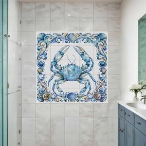 Ceramic tile mural featuring a watercolor crab surrounded by ornate seashell border and coastal ocean details for bathroom or beach house decor