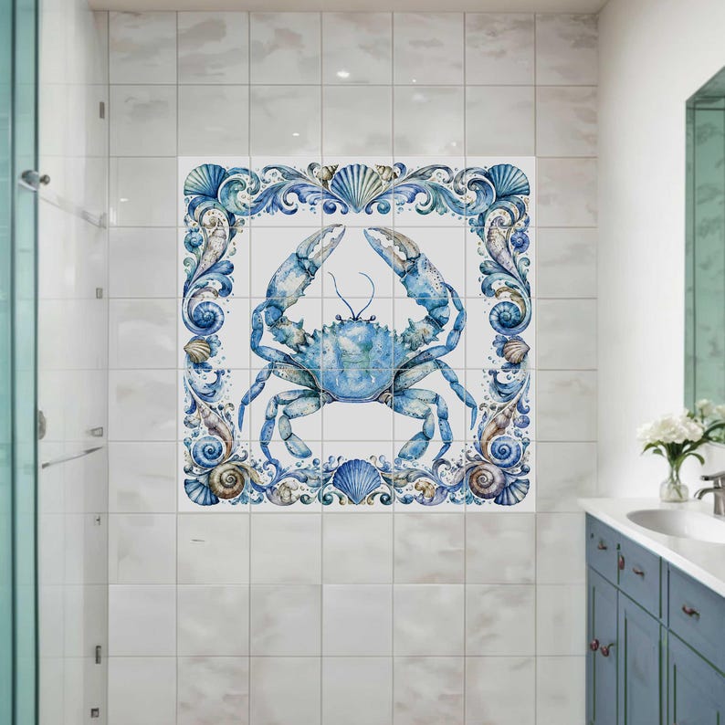 Ceramic tile mural featuring a watercolor crab surrounded by ornate seashell border and coastal ocean details for bathroom or beach house decor
