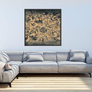May include: A framed black and white illustration with a complex, chaotic design. The artwork features numerous small figures and objects scattered across a tan background, creating a sense of movement and surrealism. The frame is dark, and the overall aesthetic is vintage.