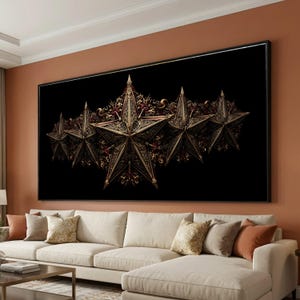 May include: A large framed artwork featuring five ornate, gold-colored stars against a black background. The stars have intricate detailing and are arranged in a row. The artwork is displayed above a cream-colored sofa.
