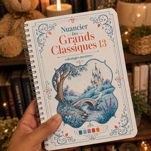 Peut inclure: Un livre de coloriage à reliure spirale intitulé Nuancier Des Grands Classiques 13 coloriages mystères. La couverture présente un fond blanc avec des volutes décoratives bleues et une illustration centrale d'un château, d'un pont en pierre et d'un arbre.