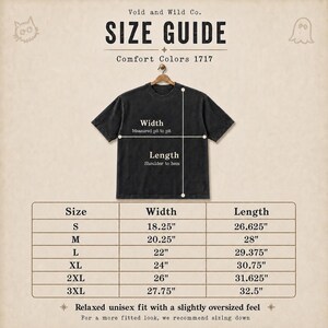 May include: A size guide chart for a Comfort Colors 1717 t-shirt by Void and Wild Co. The graphic displays a black t-shirt on a hanger with width and length measurement lines. A table lists sizes S through 3XL with corresponding measurements in inches.