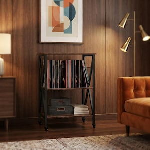May include: A three-tier rolling storage cart with a dark wood grain finish and a black metal frame. The top shelf holds a collection of vinyl records, while the lower shelves contain two rectangular storage boxes and a stack of white books.