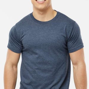 May include: A short-sleeved, crew neck t-shirt in a heathered blue color. The shirt has a classic fit and is made of a soft, comfortable material. This versatile tee is suitable for casual wear and layering.