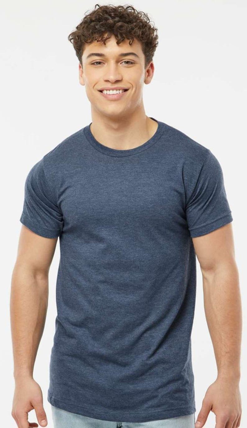 May include: A short-sleeved, crew neck t-shirt in a heathered blue color. The shirt has a classic fit and is made of a soft, comfortable material. This versatile tee is suitable for casual wear and layering.