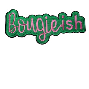 May include: Embroidered patch with the word "Bougie-ish" in pink script lettering. The text is outlined in a darker green and set against a green background with a scalloped edge. The patch is designed to be sewn or ironed onto fabric.