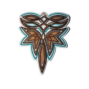 May include: An embroidered patch with a symmetrical design. The patch features a white background with a brown and teal floral pattern. The design is detailed with intricate stitching, creating a textured appearance. The patch is likely for decorative purposes, such as embellishing clothing or accessories.