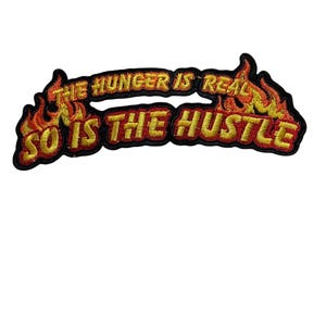 Hungern är verklig, det är även Hustle, broderad lapp
