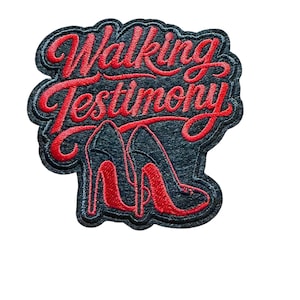 May include: An embroidered patch featuring the text Walking Testimony in bold red cursive script. Below the text are two black high-heeled shoes with red soles and red interior detailing. The entire design is set against a black felt background.