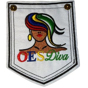 May include: Embroidered patch featuring a stylized woman with colorful hair and gold earrings. The patch is white with a black border and the text "OES Diva" in colorful letters. Two gold-colored studs are at the top corners.
