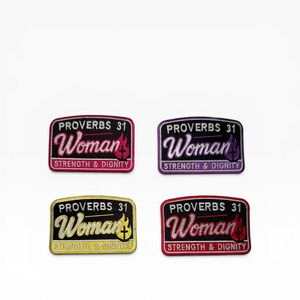 May include: Four embroidered patches with the text "PROVERBS 31 Woman STRENGTH & DIGNITY". Each patch has a different color scheme: pink, purple, yellow, and red. The patches are rectangular with a curved top.