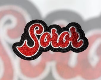 Parche bordado inspirado en Soror, rojo, negro y blanco.