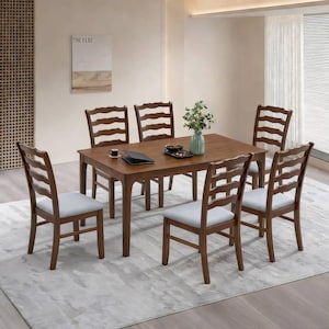 May include: A wooden dining table with six matching chairs. The chairs have ladder backs and light gray upholstered seats. The table is rectangular and has a dark wood finish. A vase of flowers and a serving tray are on the table.