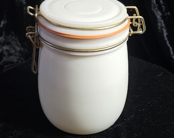 Vintage Wheaton milk glass canister with a clamp