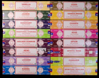 May include: A collection of Satya incense boxes, each labeled with a different scent such as Vanilla, Jasmine, and Rose. The boxes are colorful, with text in white and red, and a circular logo.