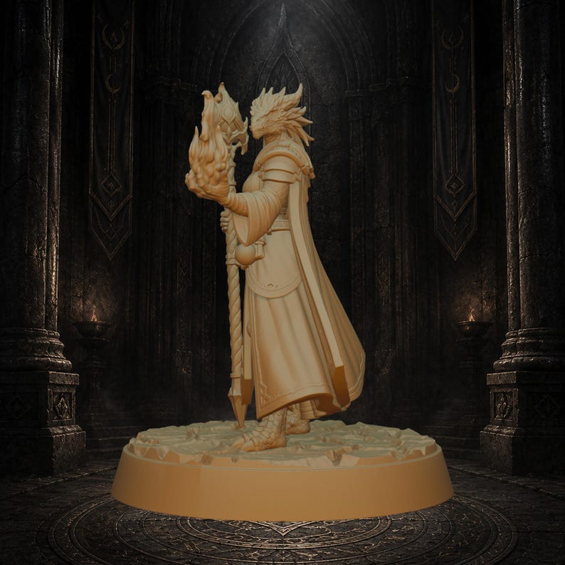 May include: A beige, unpainted miniature figurine of a reptilian humanoid figure standing on a circular base. The figure wears a long, flowing robe and armor, holding a tall staff topped with a sculpted flame element in its right hand.