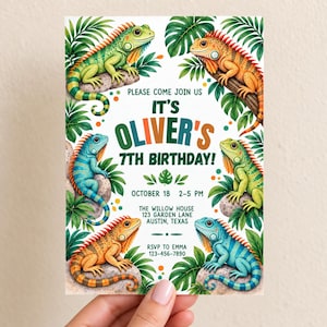 May include: A rectangular birthday invitation card featuring six colourful iguanas in green, orange, and blue perched on rocks amidst tropical leaves. The text reads: PLEASE COME JOIN US IT'S OLIVER'S 7TH BIRTHDAY! OCTOBER 18 2-5 PM THE WILLOW HOUSE 123 GARDEN LANE AUSTIN, TEXAS RSVP TO EMMA 123-456-7890.
