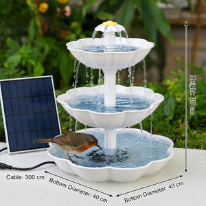 May include: A three-tiered white solar-powered fountain with water cascading down. The fountain has a flower-shaped top and a bird is drinking from the bottom tier. The fountain is 30 cm high with a 40 cm bottom diameter.