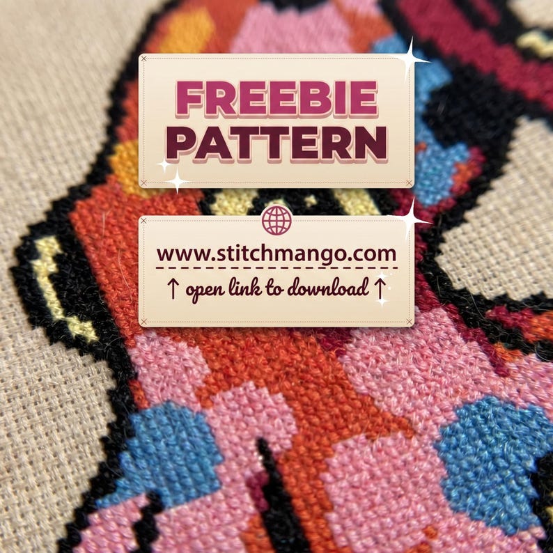 May include: Close-up of a cross-stitch butterfly pattern in pink, orange, and blue. The text "FREEBIE PATTERN" is displayed above the website address www.stitchmango.com, with an arrow pointing down to download the pattern.