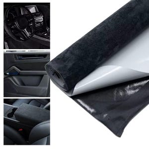 May include: A roll of black adhesive-backed suede-like fabric material with a white peel-off backing. The material is shown applied to various interior surfaces of a vehicle, including the steering wheel, door panel, and center console armrest.