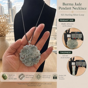 May include: A Burma jade pendant necklace featuring a hand-carved floral design on a 925 sterling silver loop and a black cord. The pendant measures 2.15 inches in width and 0.20 inches in thickness as shown by the digital calipers.