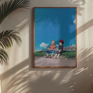 May include: A framed art print featuring an anime-style illustration of two characters sitting on a grassy hill under a blue sky with clouds. One character wears a red and brown striped shirt, the other a black dress and red bow.