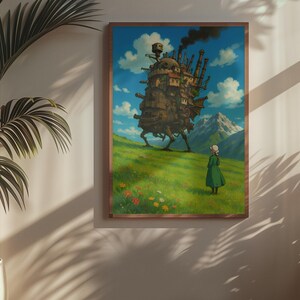 May include: A framed art print featuring a whimsical illustration of a moving castle on a green hillside under a blue sky with clouds. A person in a green dress stands in the foreground. The artwork is in a wooden frame.