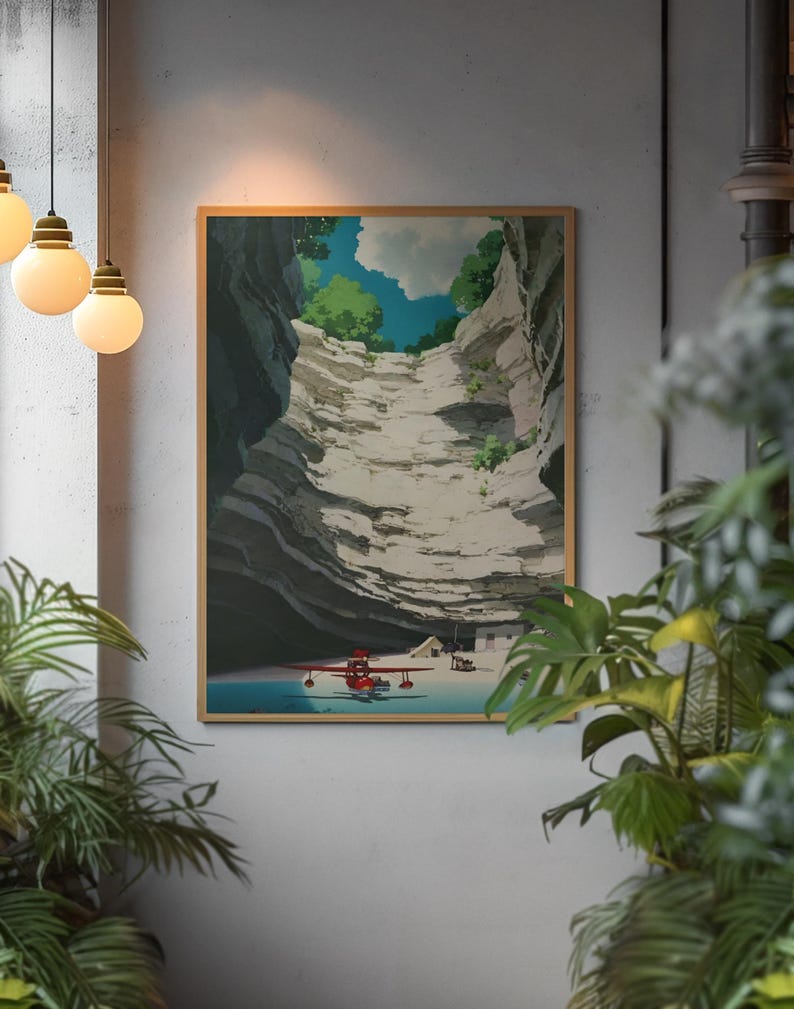 May include: A framed art print depicts a serene landscape with a red seaplane on a blue body of water, nestled within a canyon. The artwork features a light brown frame and a detailed illustration of the canyon walls, trees, and clouds.
