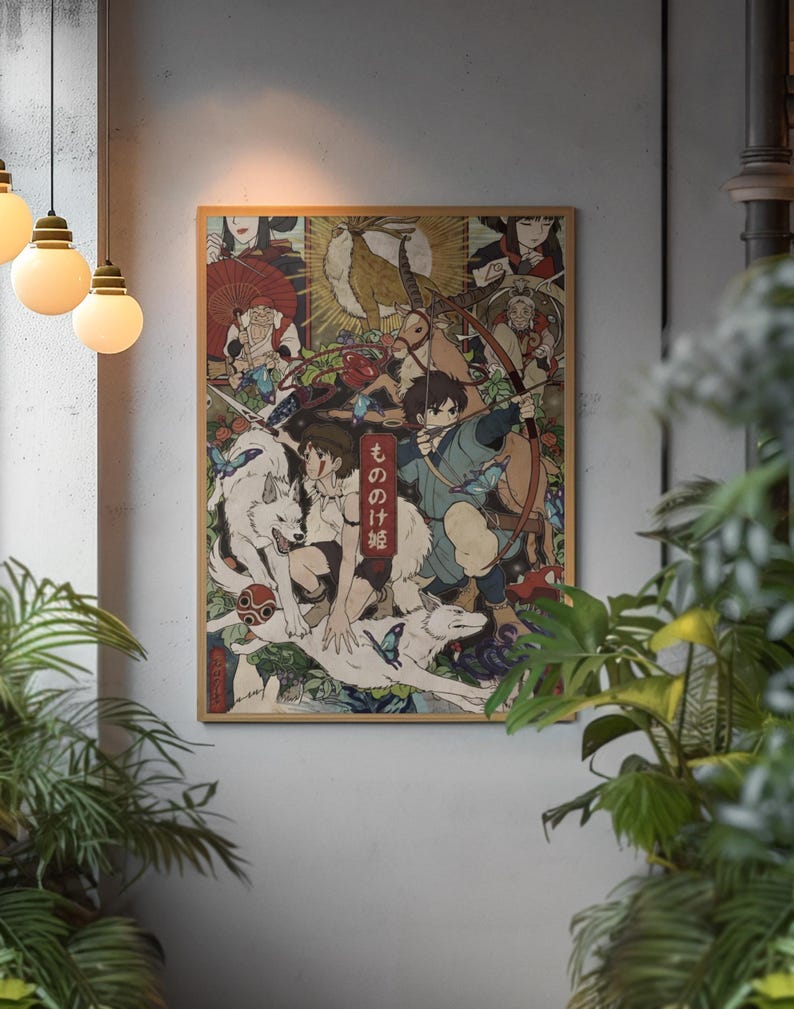 May include: A rectangular wall poster featuring a detailed anime-style illustration with multiple characters, including a person with a bow and arrow, white wolves, and a deer-like creature. The vertical red text reads もののけ姫. The artwork is framed in light wood.