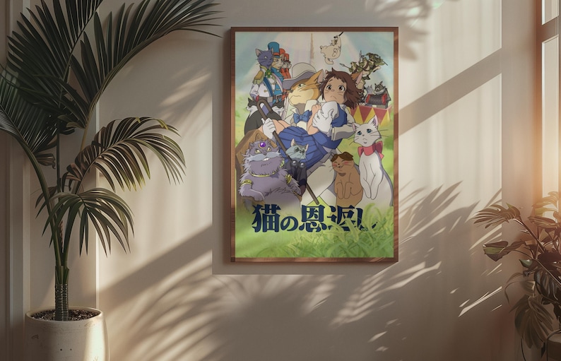May include: A framed poster featuring a colorful anime illustration with multiple cat characters. The artwork includes a central female figure surrounded by various cats, with Japanese text at the bottom. The poster is displayed on a wall next to a potted plant.