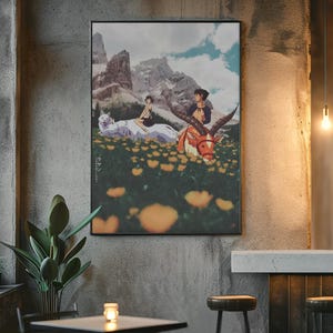 May include: Framed art print with an anime-style illustration. The artwork shows two figures with a white wolf and a horned creature in a field of yellow flowers, with mountains in the background. The sky is blue with clouds.