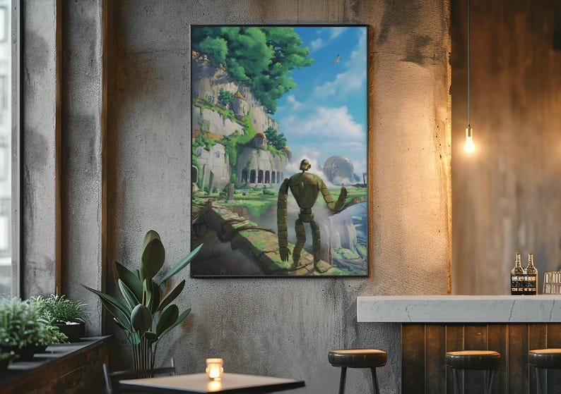 Puede incluir: Impresi&oacute;n art&iacute;stica enmarcada que representa un robot gigante frente a un paisaje verde con acantilados, &aacute;rboles y un cielo azul nublado. La obra de arte est&aacute; colgada en una pared de hormig&oacute;n, creando un contraste interesante.