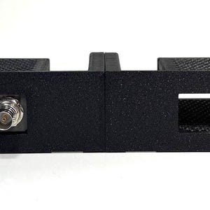 Soporte para rack 1U para 4 miniconvertidores de fibra óptica Blackmagic Design de 12 Gbps.