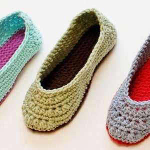 May include: Three pairs of crocheted slippers in different colors. The slippers are made with a soft yarn and have a comfortable fit. The colors are light blue, green, and gray.